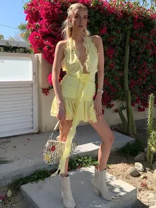 Sexy yellow halter ruffled dress with 3D flower decoration and pleated details