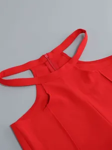 Close-up detail of red halter neckline featuring a sexy cutout design and hidden back zipper