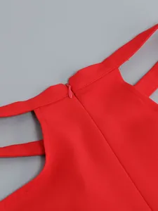 Detailed macro view of red hollow-out women's suit set with back zipper closure