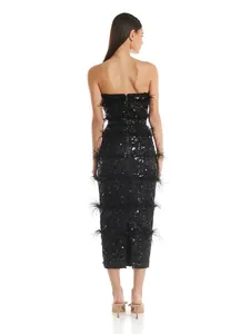 Back view of a black strapless sequin midi dress featuring elegant ostrich feather rows.