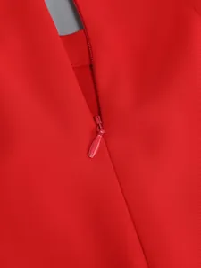 Detail view of the concealed back zipper on high-quality red formal blazer suit.