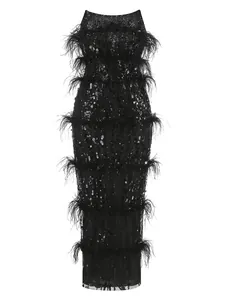 Elegant black sequin tube top dress featuring tiered ostrich feather trim detail.