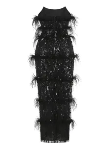 Detailed view of elegant black sequin strapless dress with tiered ostrich feather trim.