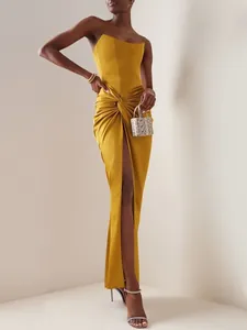 Elegant mustard yellow strapless maxi dress with twist waist and high split