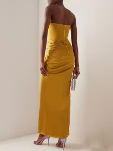 Elegant mustard yellow strapless maxi evening dress with a stylish back zipper detail.