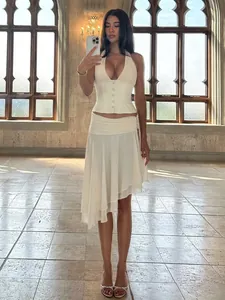 Elegant white halter neck corset with matching asymmetrical ruffled mesh skirt