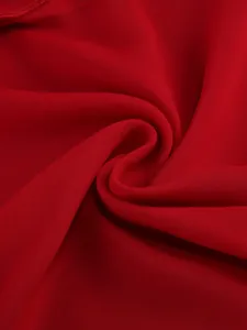 Macro detail of breathable red chiffon fabric texture for sexy ruffle maxi dress