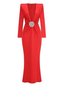 Front view of elegant red long sleeve evening gown with deep V-neck and crystal buckle