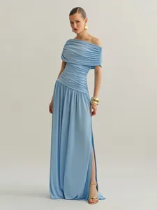 Full-length view of a light blue off-the-shoulder ruched maxi dress on a model