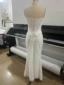 Detailed view of the elegant lace evening dress with a corset-style lace-up back design