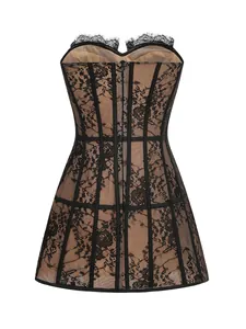 Detailed view of a sexy black lace corset dress with nude lining and mesh trim