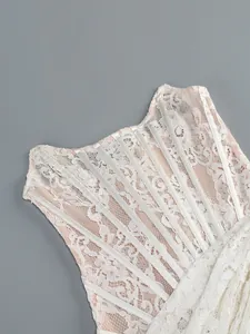 Close-up detail of white floral lace corset dress with elegant satin ribbon boning