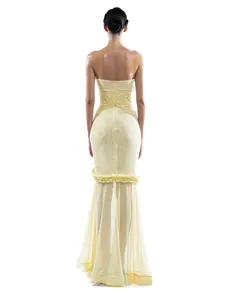 Back view detail of sexy yellow strapless mesh patchwork mermaid evening dress gown