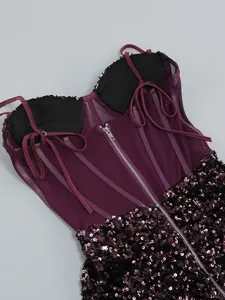 Detailed macro shot of the back zipper and sequin texture on a purple mesh corset dress