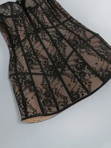 Detailed view of elegant black lace mesh bodycon dress with corset-style fishbone support