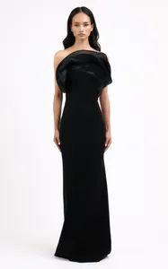Detailed view of black strapless evening gown with elegant ruffle flower detail on bust