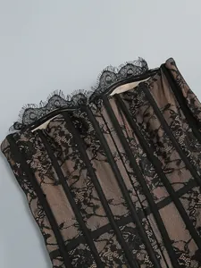 Close-up detail of black eyelash lace mesh tube top dress with structural boning
