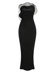 Elegant black strapless maxi dress featuring a large sheer organza ruffle neckline