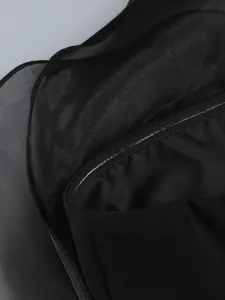 Close-up detail of black strapless dress featuring anti-slip silicone strip and mesh fabric.