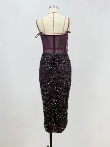 Detailed back view of a sexy burgundy sheer mesh corset dress with sparkling sequins.