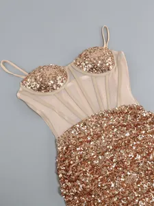 Detailed view of sexy rose gold sequined party dress with mesh corset bodice design.