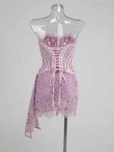 Detailed back view of a pink lace corset dress featuring an elegant lace-up closure.