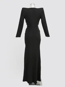 Detailed back view of a sleek black floor-length gown featuring structured shoulder pads