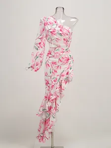 Close-up of floral one-shoulder ruffle dress with asymmetrical hem on mannequin