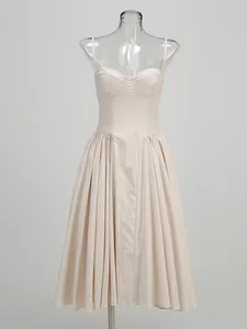 Elegant champagne spaghetti strap midi dress featuring a pleated skirt for formal banquets