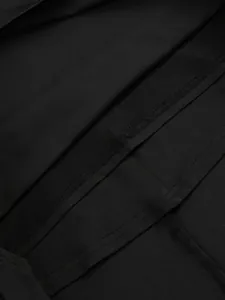 Macro view showing inner seam stitching and fabric texture of black long sleeve dress