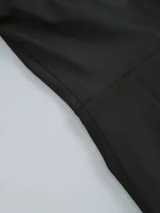 Close-up detail of high-quality black long sleeve evening gown seam and fabric texture