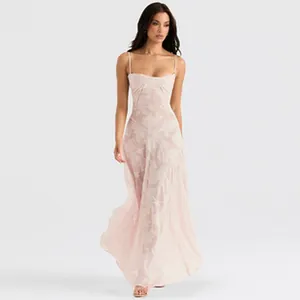 Full length view of light pink floral lace slip dress on model in studio setting