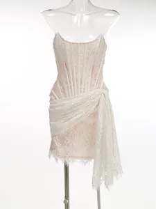 Elegant white lace strapless mini dress with corset boning and draped sash for parties