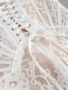 Detail view of elegant white floral lace dress bodice with satin ribbon lace-up