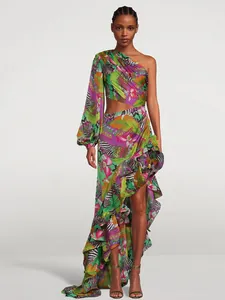 Detailed view of vibrant asymmetric one-shoulder floral maxi dress with waist cutout and ruffles