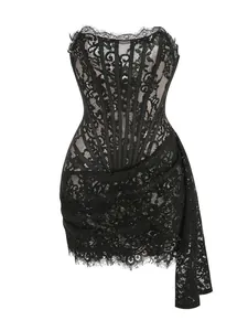 Close-up of black lace corset dress with sheer mesh panels and long side sash