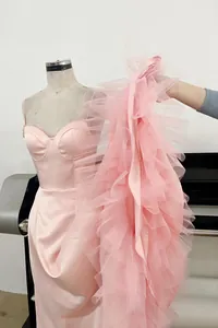 Detail view of luxury pink tulle tiered skirt for formal evening gown and party dress