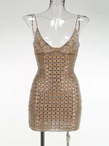 Champagne bodycon mini dress with silver grid rhinestone pattern on clear mannequin