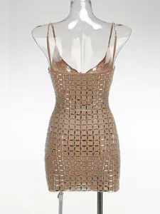Detailed view of a nude bodycon mini dress with intricate silver rhinestone grid patterns