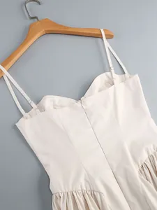 Close-up of elegant white camisole dress with sweetheart neckline and back zipper