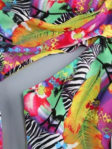 Close-up of vibrant tropical floral and zebra print fabric on a summer vacation dress
