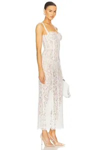 Side view detail of a white lace cutout camisole dress with elegant floral patterns