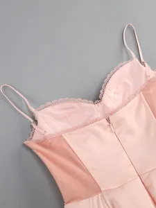 Close-up of pink evening dress back with delicate lace trim and invisible zipper detail
