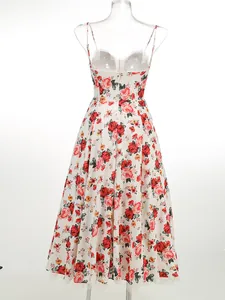 Back view detail of elegant floral spaghetti strap midi dress featuring a flared mesh hemline