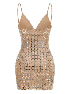 Close-up detail of nude bodycon mini dress with intricate silver rhinestone grid patterns