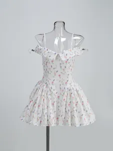 Detailed view of elegant white floral off-the-shoulder strap dress with a puffy skirt