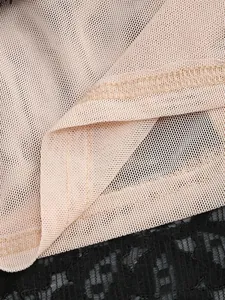 Close-up detail showing high-quality lace and see-through mesh fabric stitching