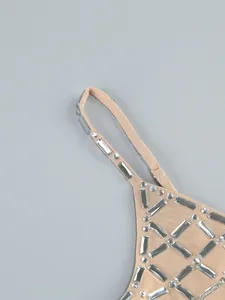 Close-up detail of luxury mesh evening dress with silver rectangular rhinestones
