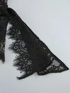 Close-up of elegant black floral lace ribbon with eyelash lace edge for evening dress