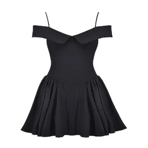 Close-up detail of elegant black off-shoulder cocktail dress with spaghetti straps